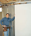 Installing wall panels on top of our basement wall insulation in Peekskill